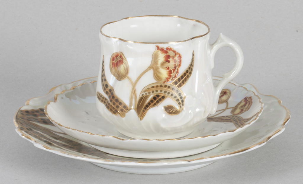 Art Nouveau style porcelain cup with two saucers