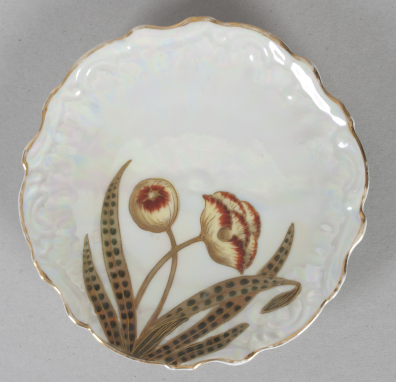 Art Nouveau style porcelain cup with two saucers