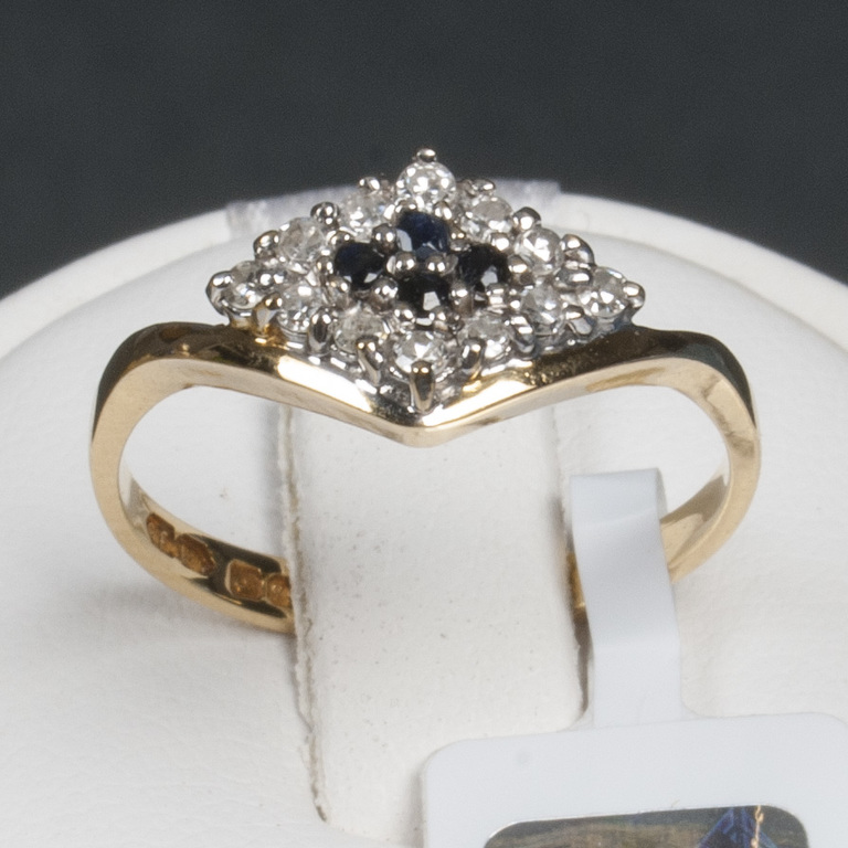 Golden ring with diamonds and sapphires