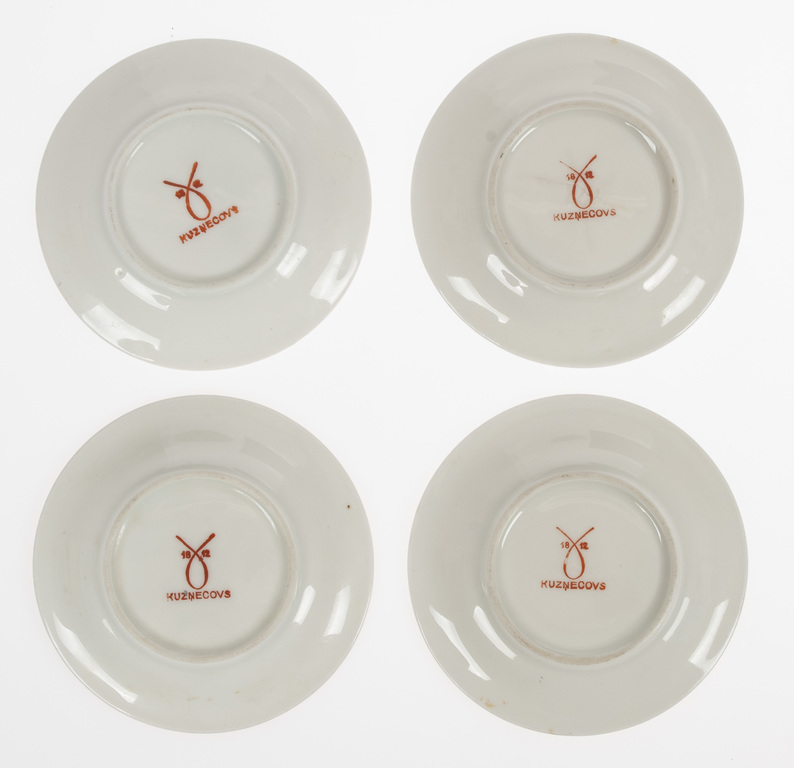Porcelain saucers (4 pcs.) with a floral pattern