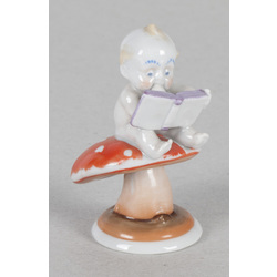 Porcelain figure „Boy with a book on fly-agaric”