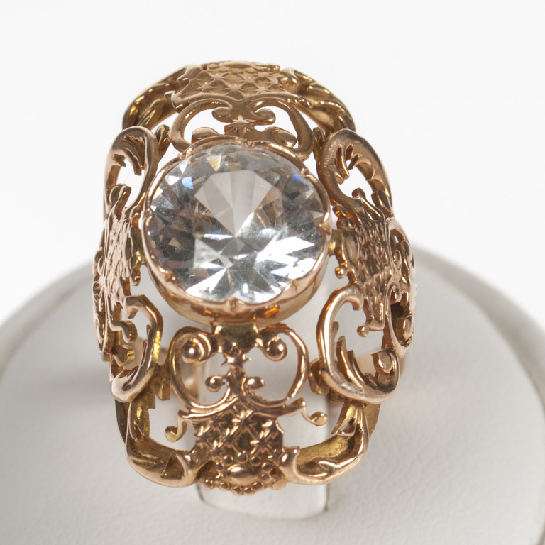 Gold ring with white stone