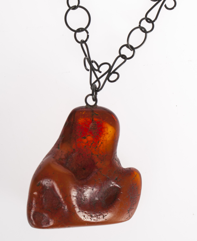 Metal necklace with amber pendant