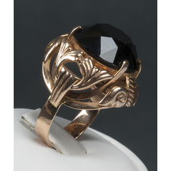 Gold ring with a black stone