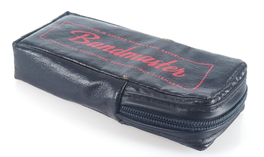 Mouth organ(harmonica) in the leather purse