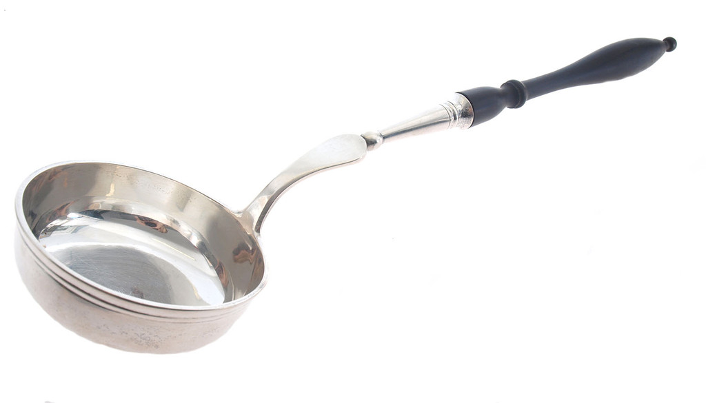Silver soup spoon with wooden handle