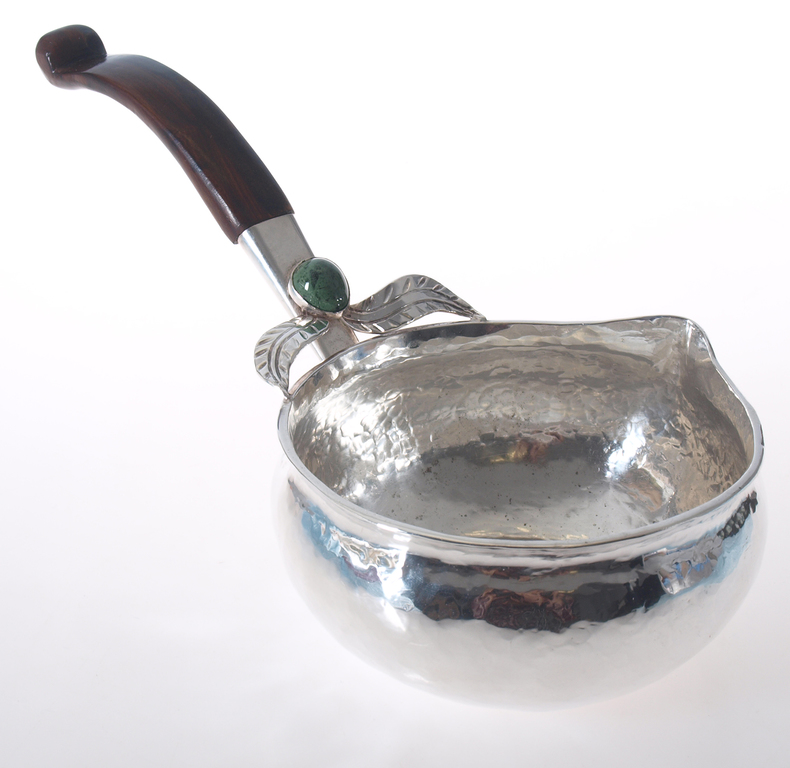 Silver cup with a wooden handle