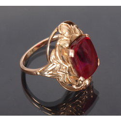 Gold ring with a red stone