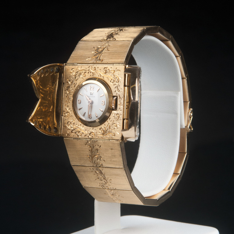 Omega zelta rokassprādze ar pulksteni