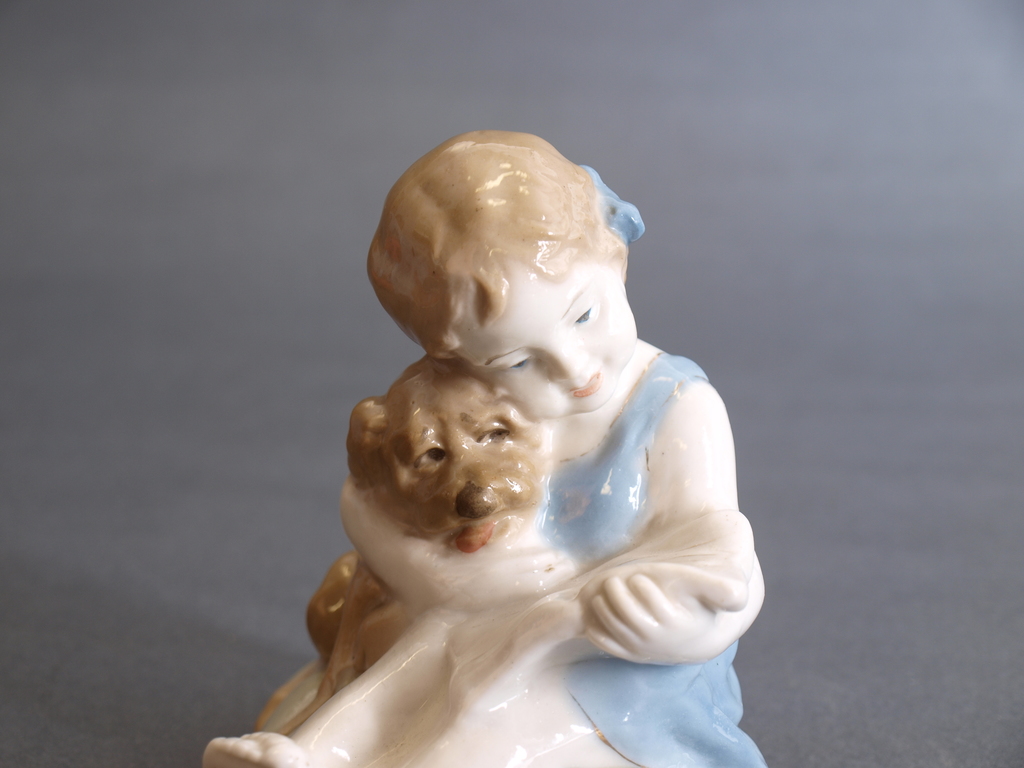 Porcelain figure “Girl with the dog reading book”