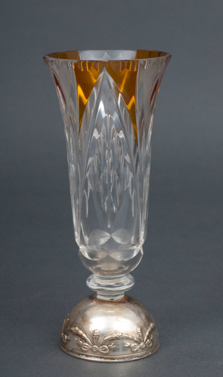 The colored glass vase with silver-plated metal finish