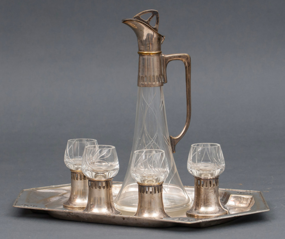 Art Nouveau style decanter with four cups and tray