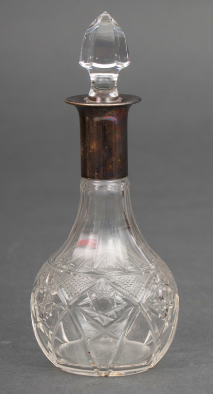 Crystal decanter with silvered metal