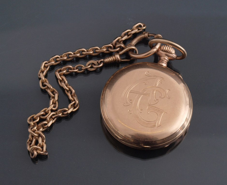 Gold pocket watch with chain  