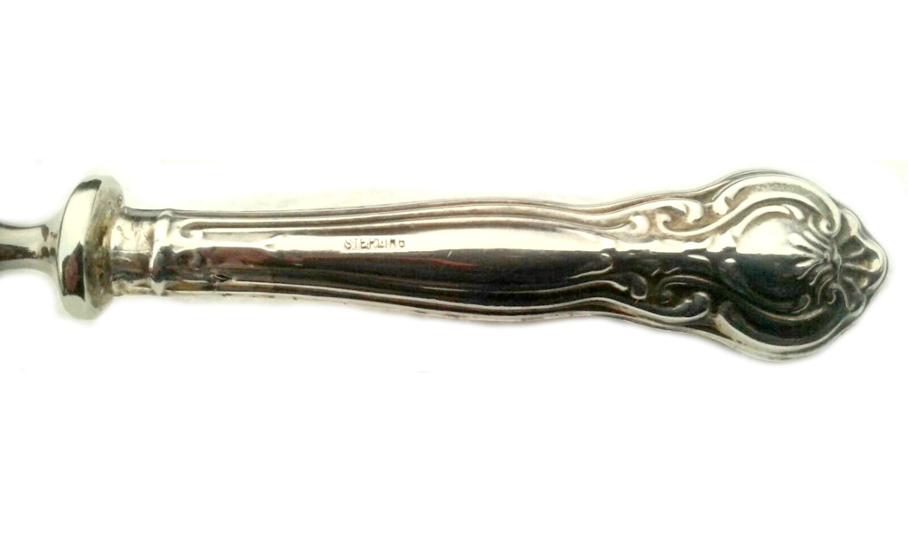 Silver-plated sauce spoon with silver handles