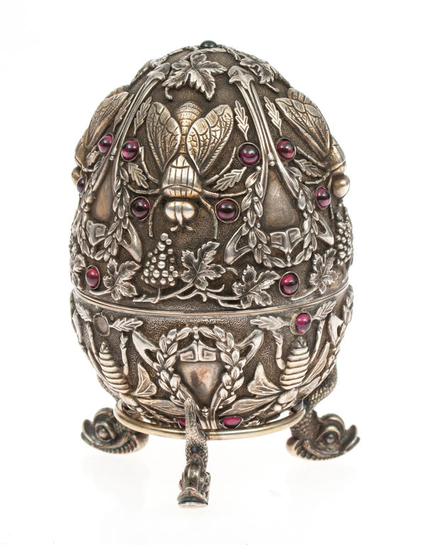 Silver egg with stand and garnets