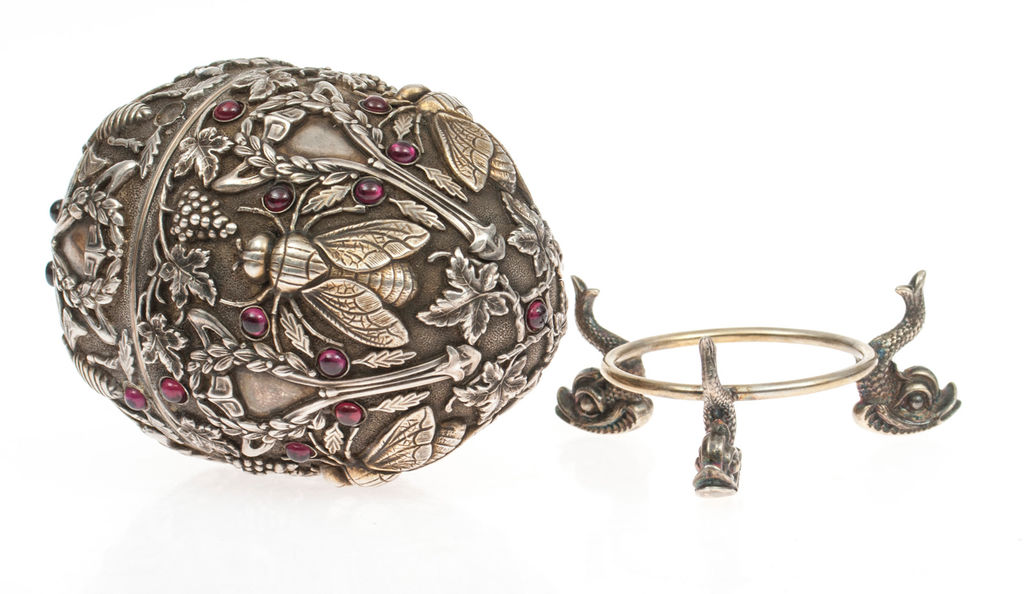 Silver egg with stand and garnets