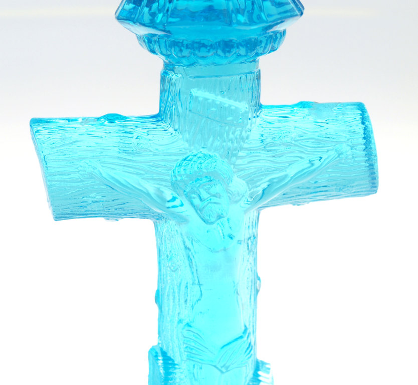 Colorful glass candlestick with a religious theme