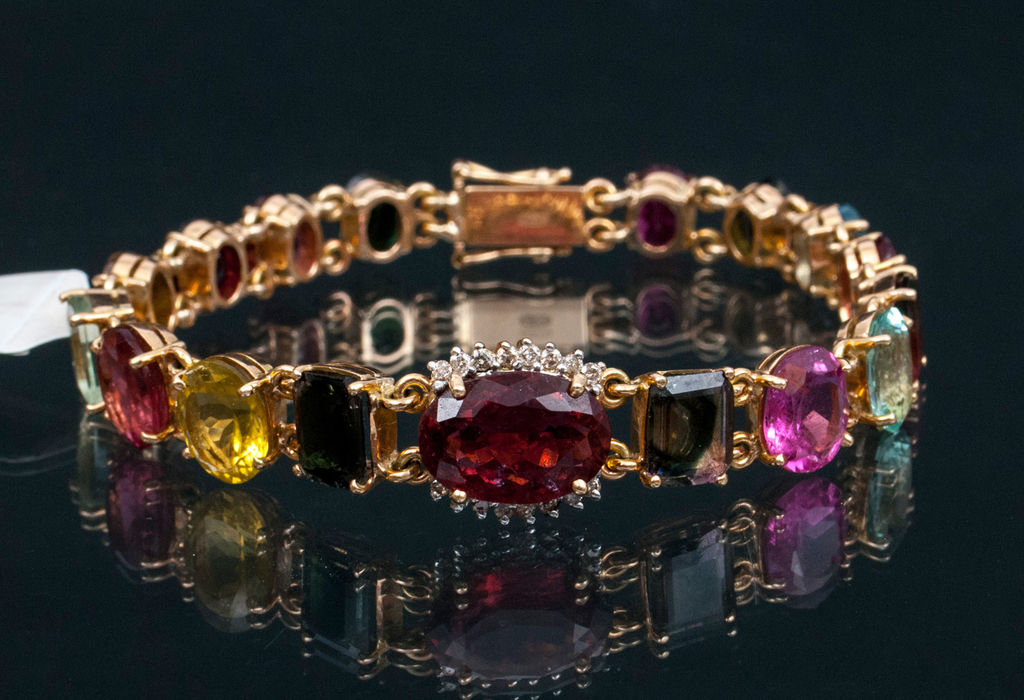 Gold bracelet with brilliants and colourful  tourmalines