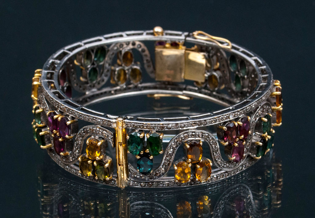 Gold bracelet with citrines, diamonds, rodolites and turmalines