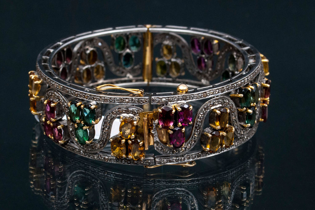 Gold bracelet with citrines, diamonds, rodolites and turmalines