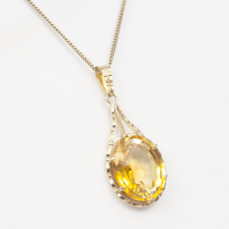 Gold necklace with yellow stone