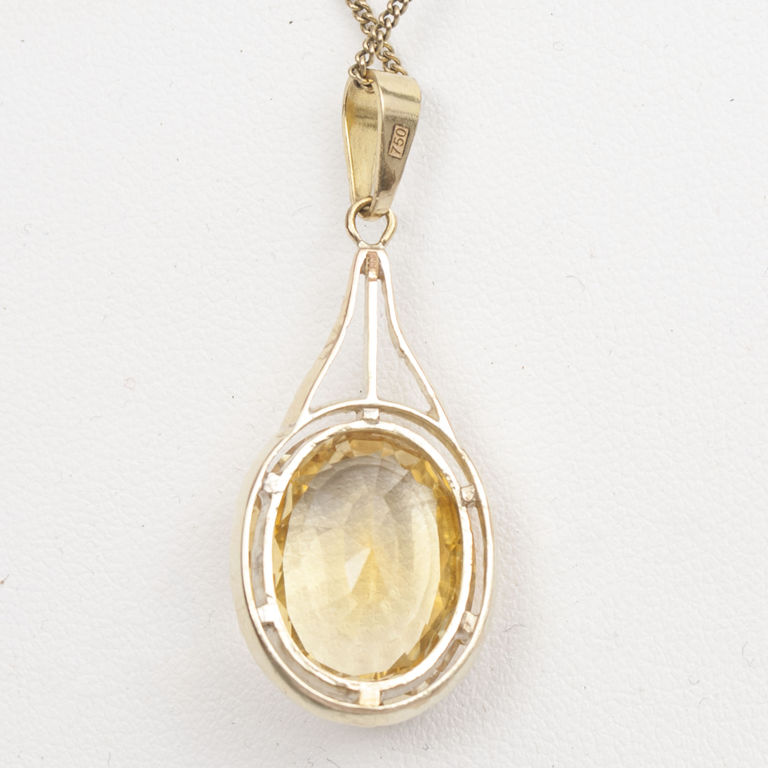 Золотое ожерелье с желтым камнем