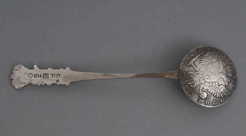 Silver spoon with a ruble coin