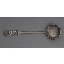 Silver spoon with a ruble coin