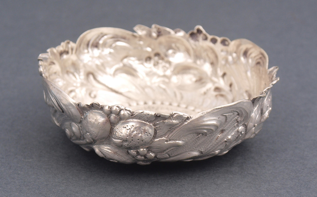 Silver decorative utensil with coin