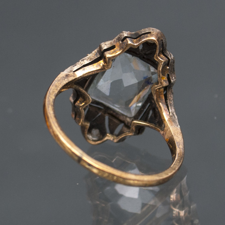 Gold ring with diamonds and gemstone