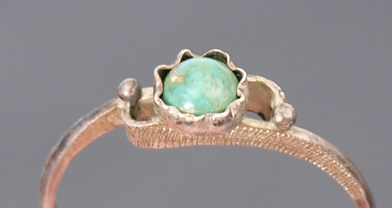 Silver ring with green stone