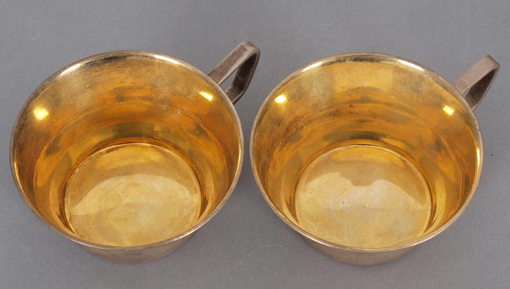 Two silver cups with gilding