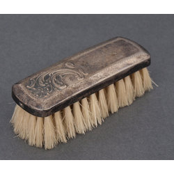 Clothing brush in silver frame