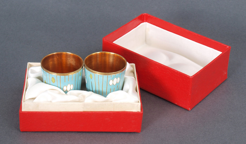 Two metal cups with enamel