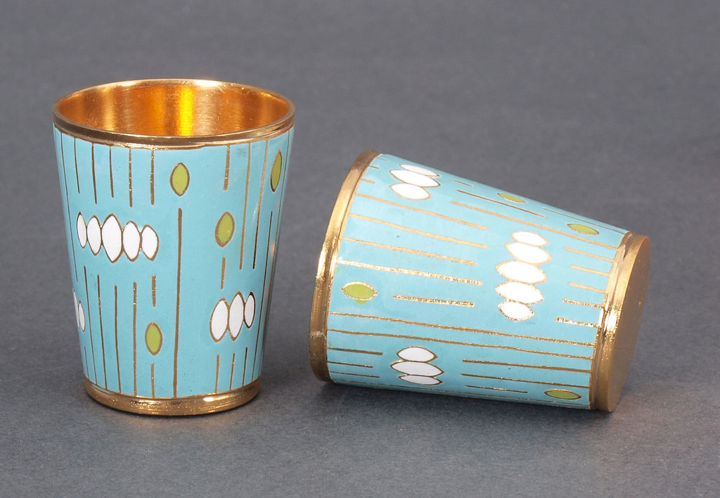 Two metal cups with enamel
