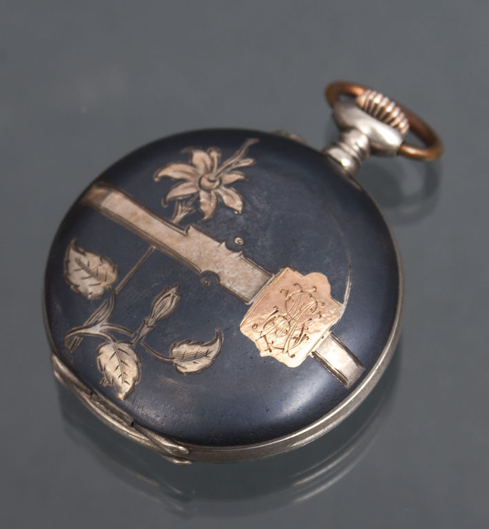Silver pocket watch with gold