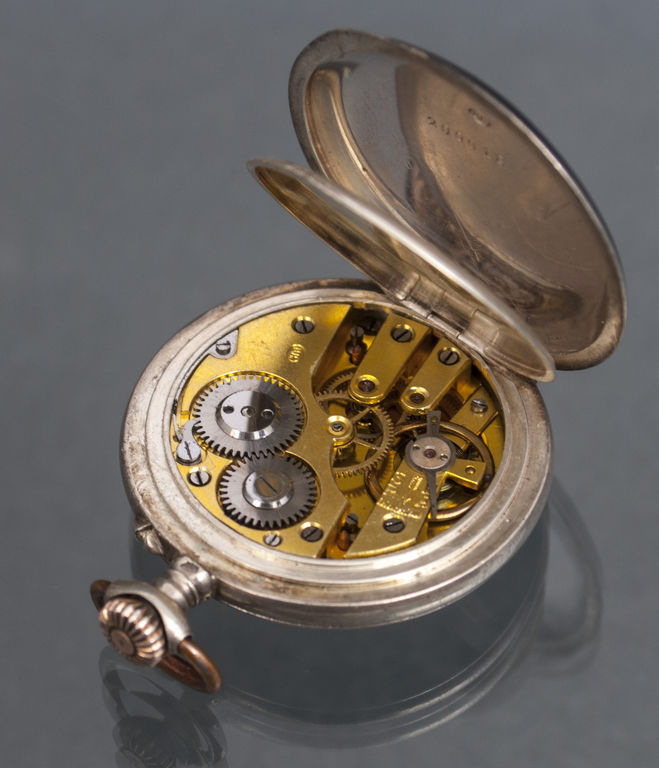 Silver pocket watch with gold