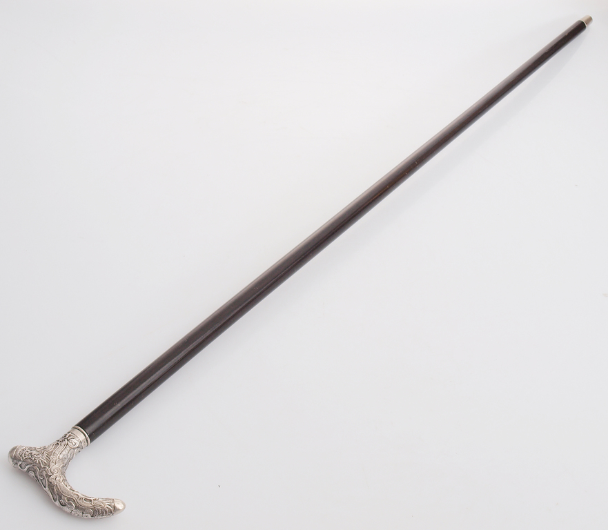Walking stick with a silver handle 
