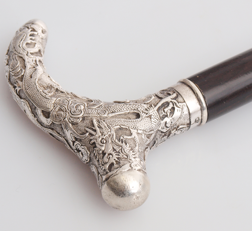 Walking stick with a silver handle 