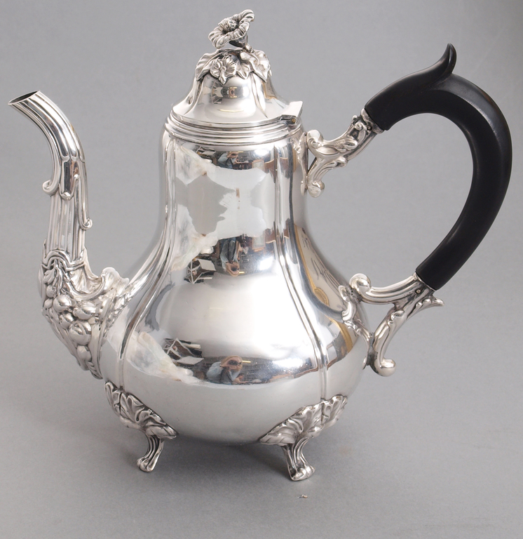 Silver teapot with wooden handle
