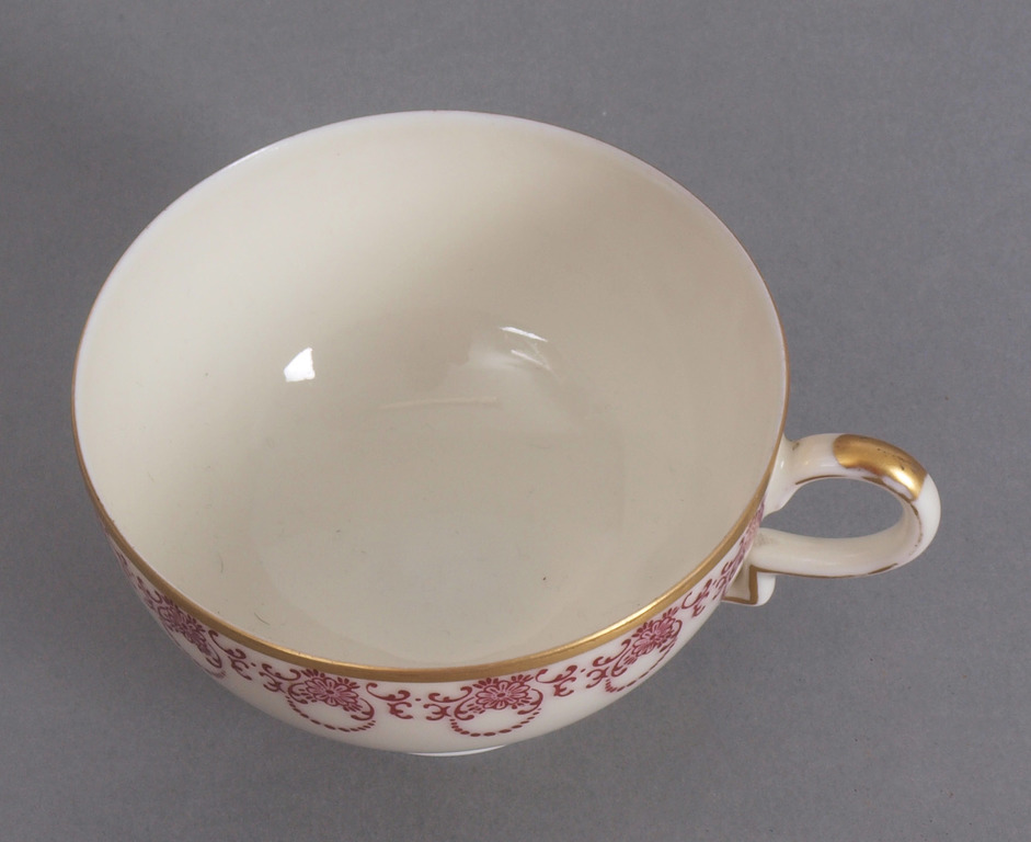 Porcelain cup with saucer and dish