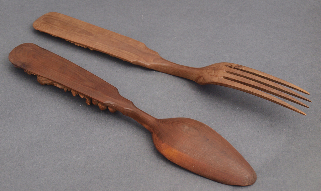 Cherry wood spoon and fork with carvings