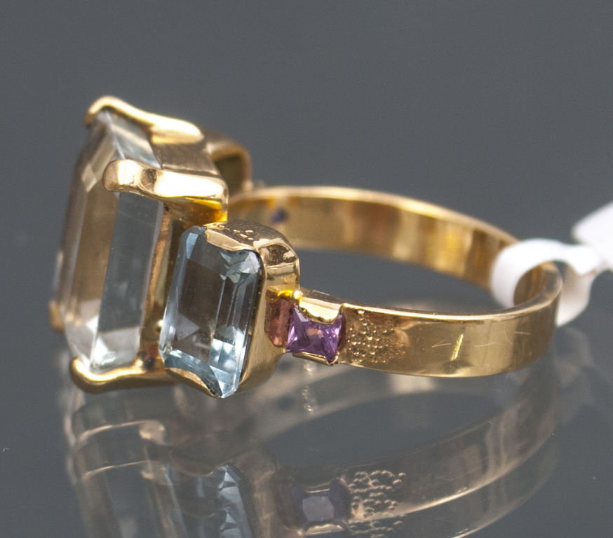 Gold ring with aquamarine, sapphires, topazes