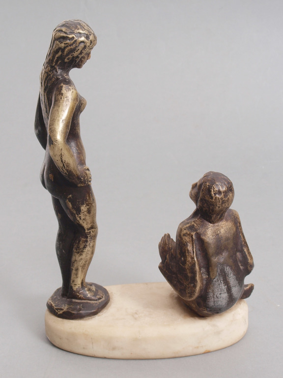Bronze figure on the marble base 