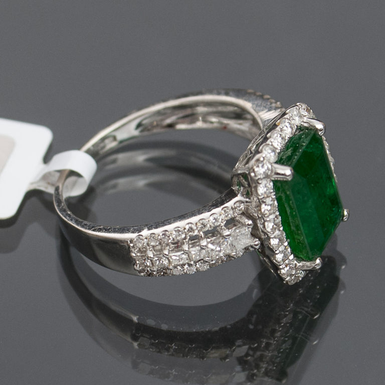 White gold ring with emeralds and diamonds