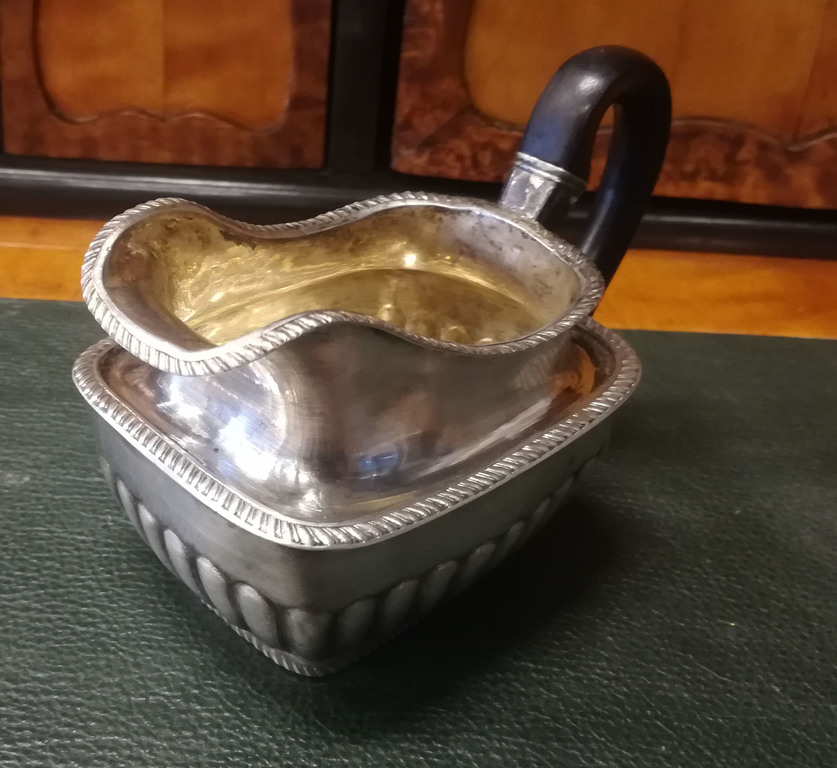 Silver canister with wooden handle