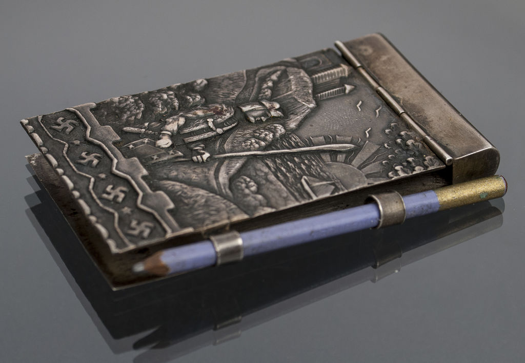 Silver notebook with pencil