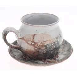 Ceramic cup with saucer