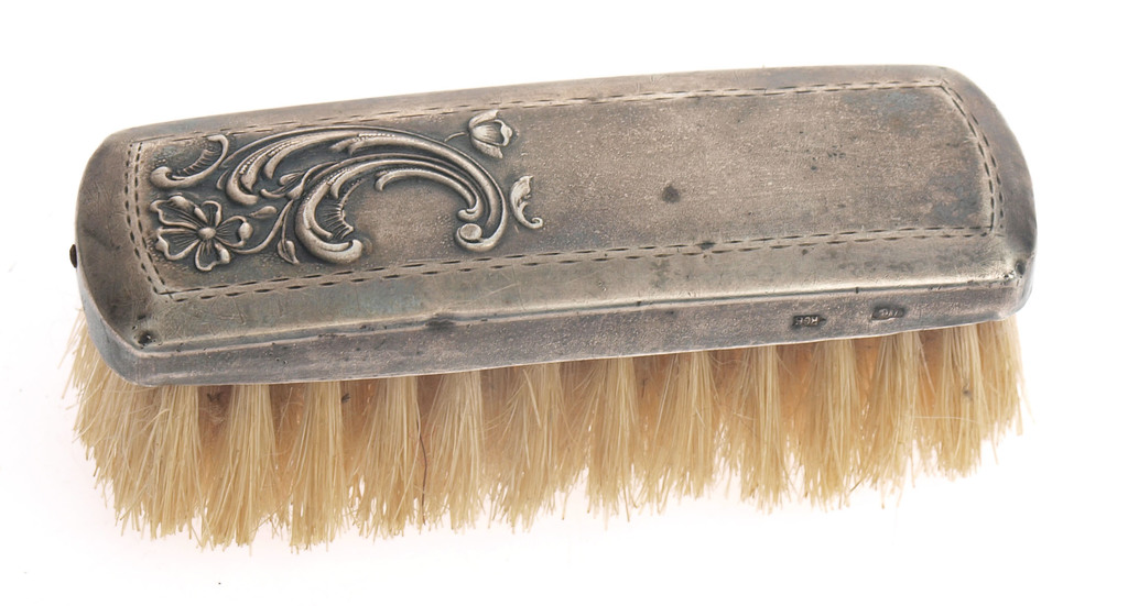 Clothing brush with silver finish